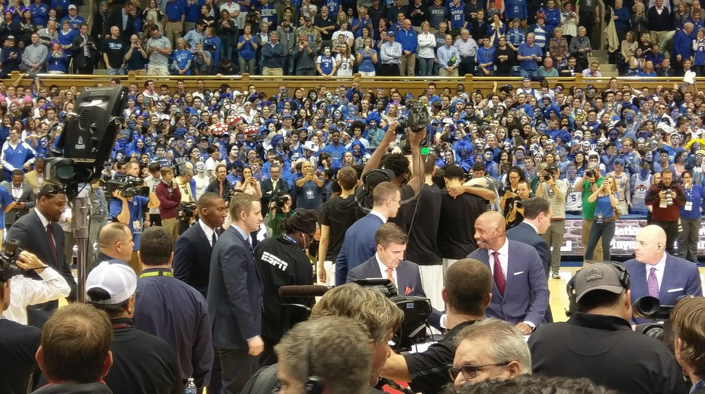 Duke players and coaching staff, and ESPN commentators