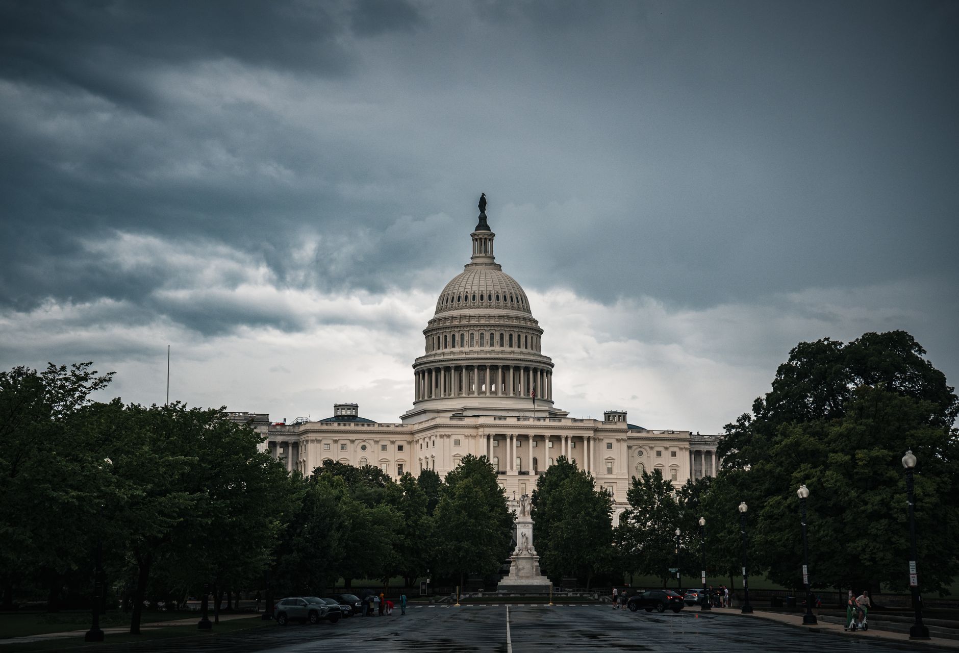 National landmarks captured with a dramatic sky, Washington DC's Capitol shines.