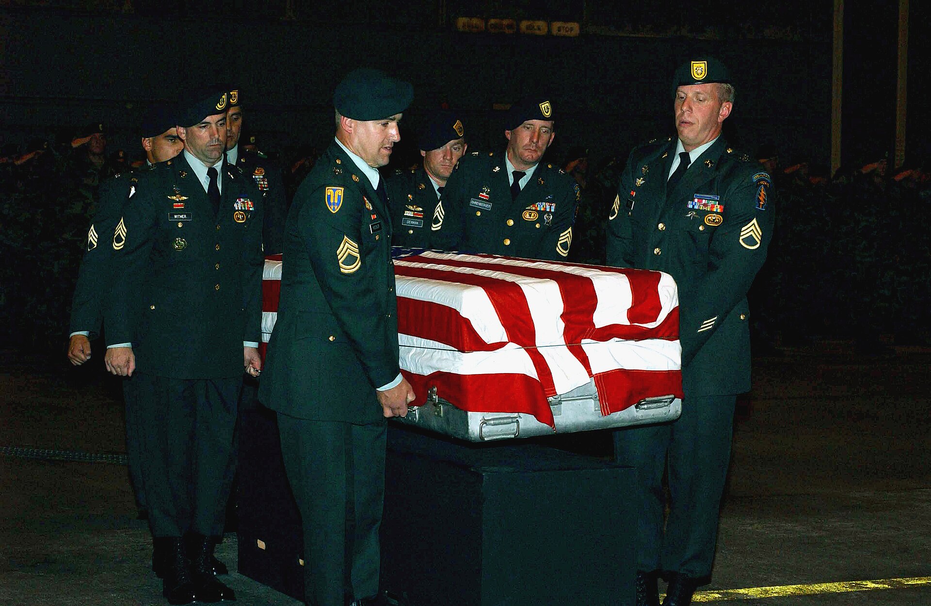 A US Army (USA) Honor Guard Team, from 1ST Battalion, 1ST Special Forces Group (Airborne) transports a flag draped transfer case carrying the remains of USA Sergeant First Class (SF DPLA 0a2379b01119a3a1e0c17fc450e8a378