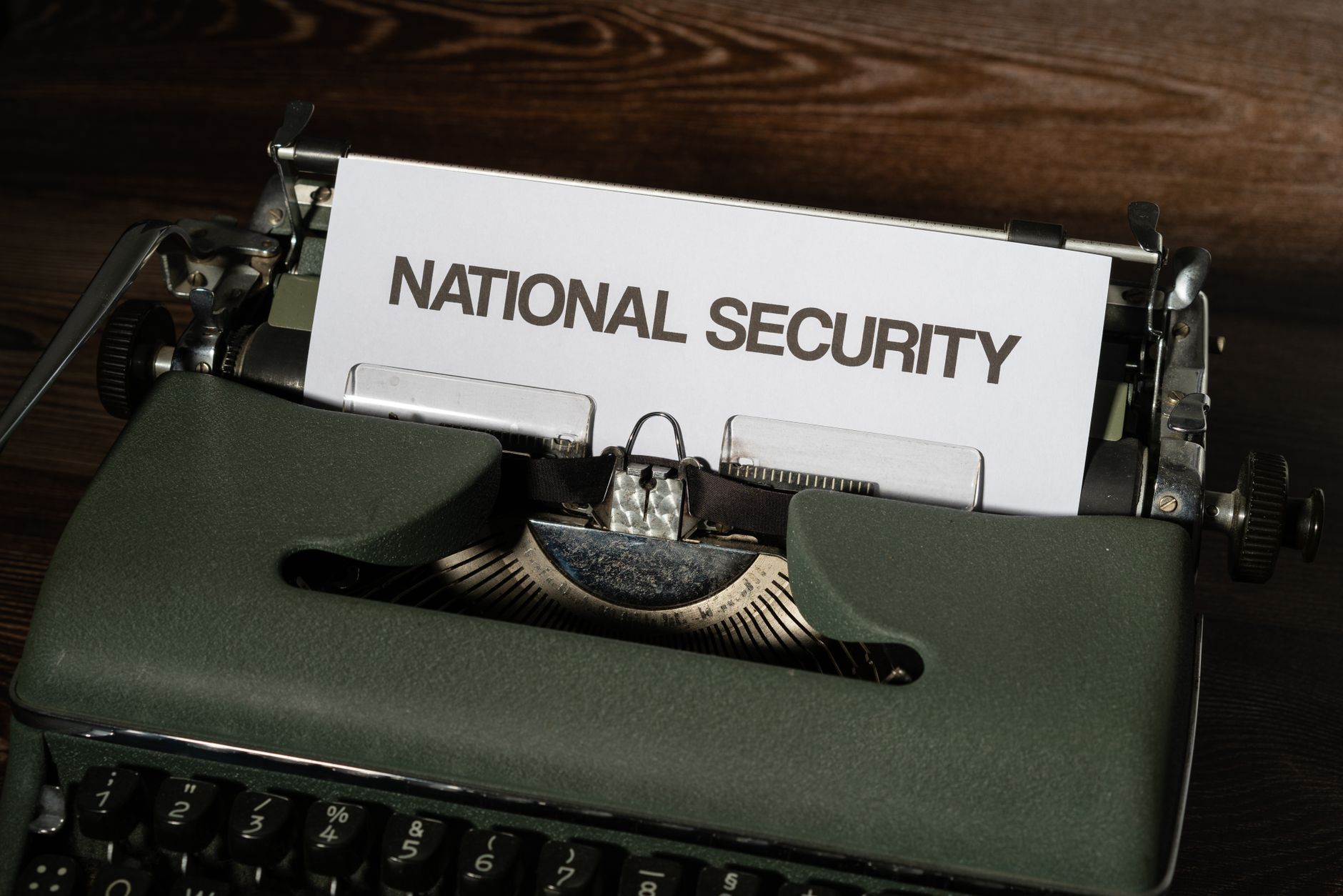 Close up of a vintage typewriter with a paper showing the words 'National Security.'
