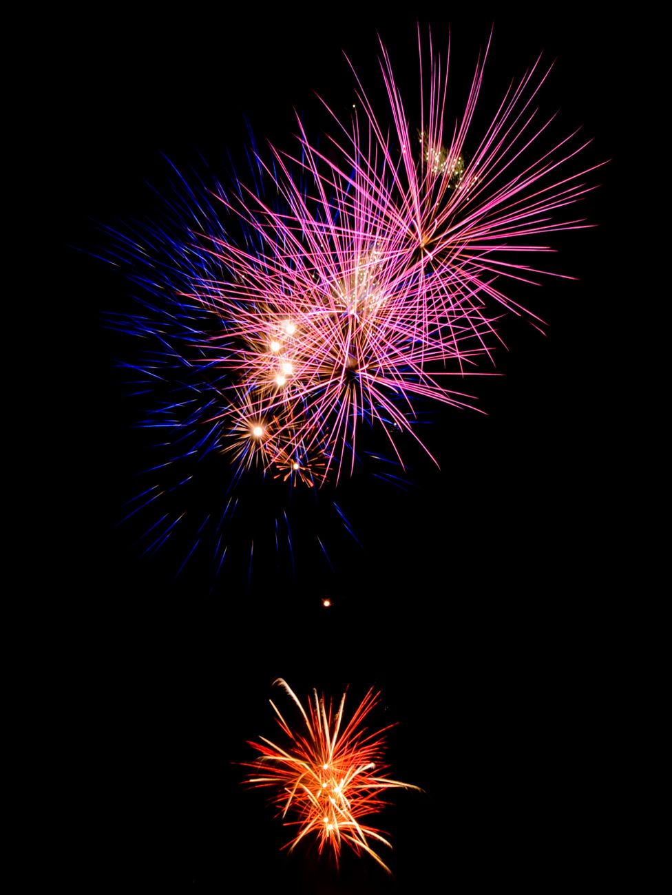 Bright and colorful fireworks exploding in the night sky, creating a vibrant display in Gatesville, TX.