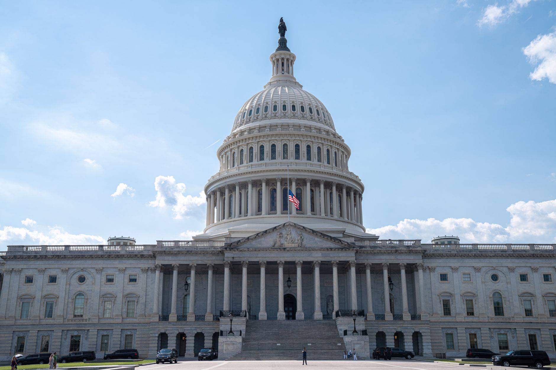 Stunning architectural shot of the US Capitol under a clear blue sky.