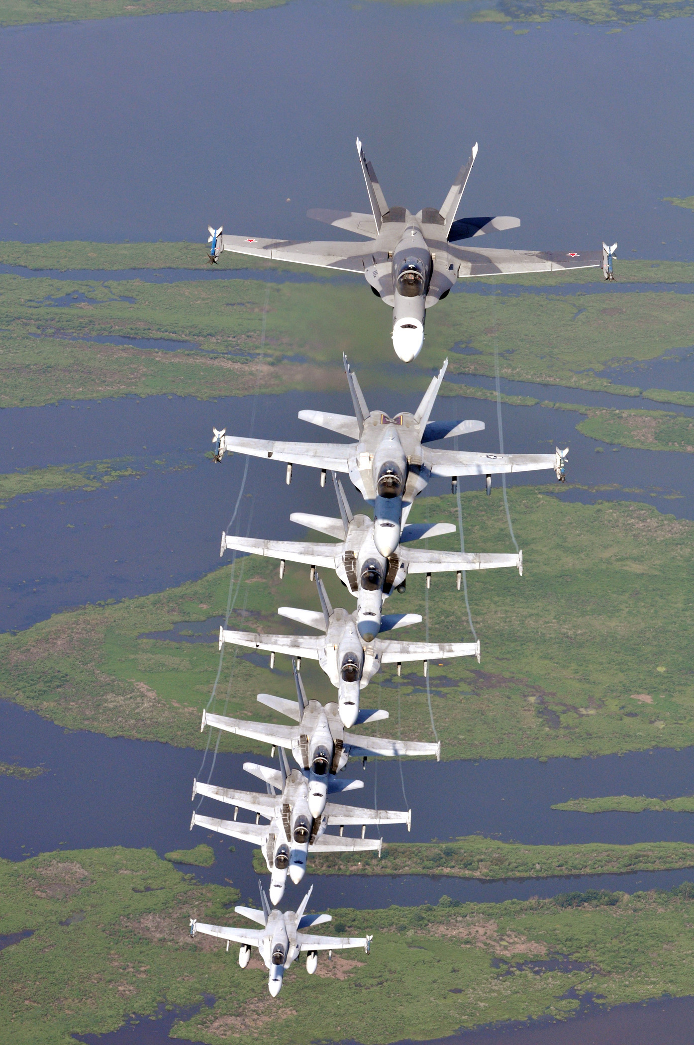 US Navy 090711 N 9712C 007 ight F A 18 Hornets assigned the River Rattlers, Strike Fighter Squadron (VFA) 204, fly in a column formation over southern Louisiana&amp;#39;s wetlands during a photo exercise