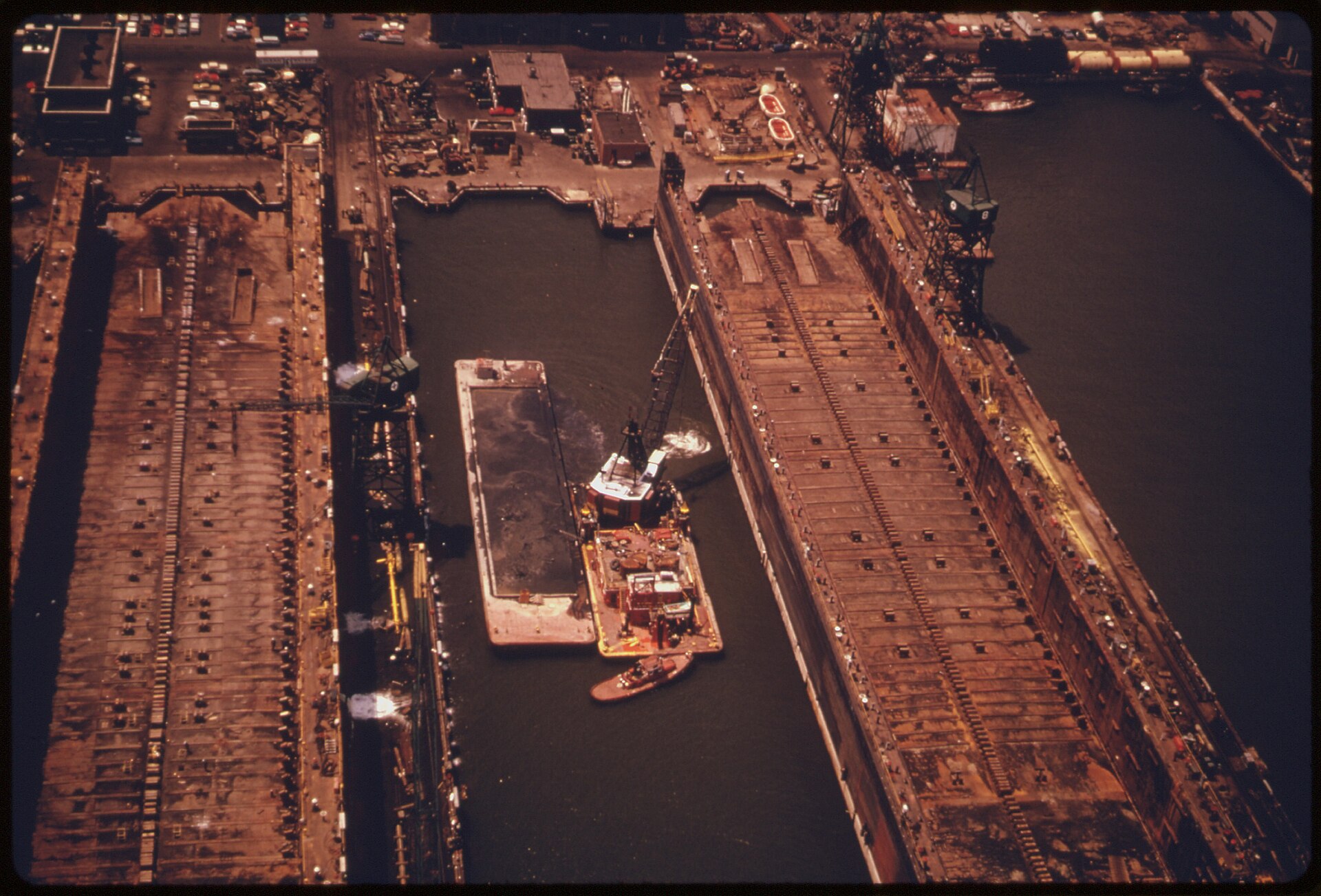 DREDGING NEW YORK HARBOR FOR SPOILS THAT WILL BE DUMPED IN THE NEW YORK BIGHT. DREDGE SPOILS ARE AS CONTAMINATED AS... NARA 555806