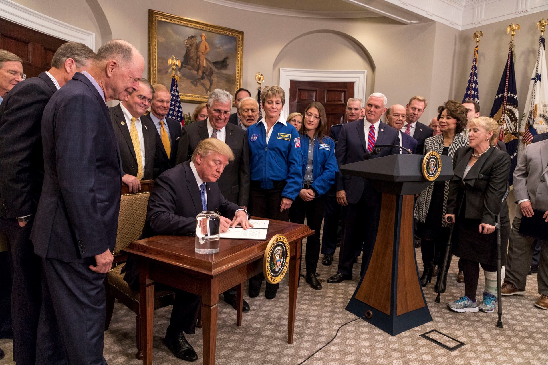 President Donald Trump displays his signed Space Policy Directive 1 in the Roosevelt Room at the White House